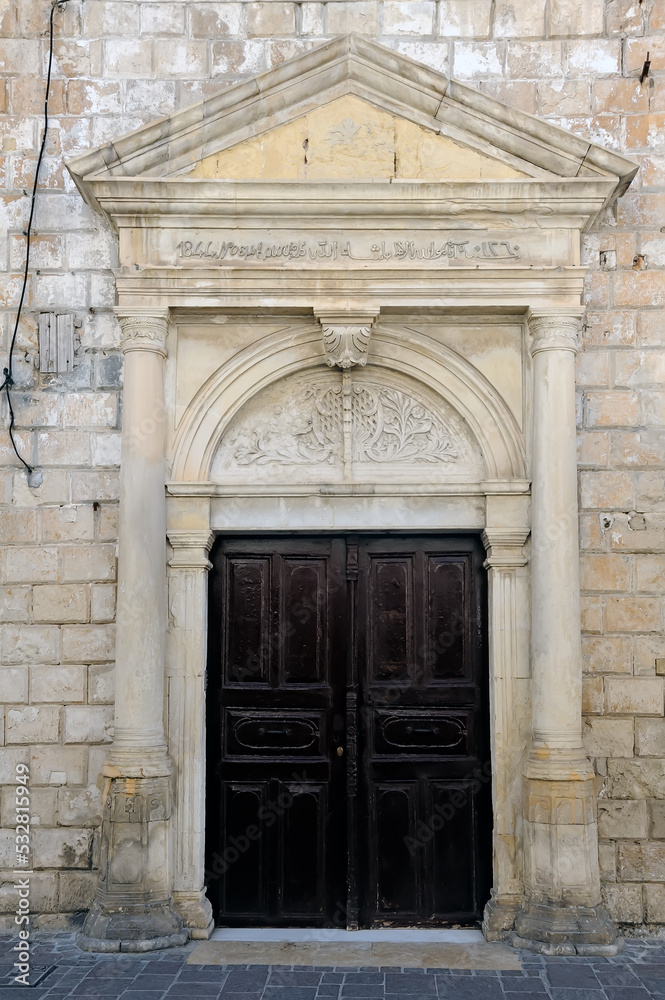 Old Venetian door facade in city of Rethymno, Crete, Greece