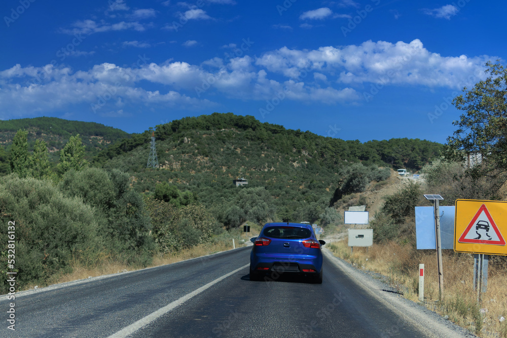 Fototapeta premium Highway wide road, transport and blue sky with clouds on a summer day