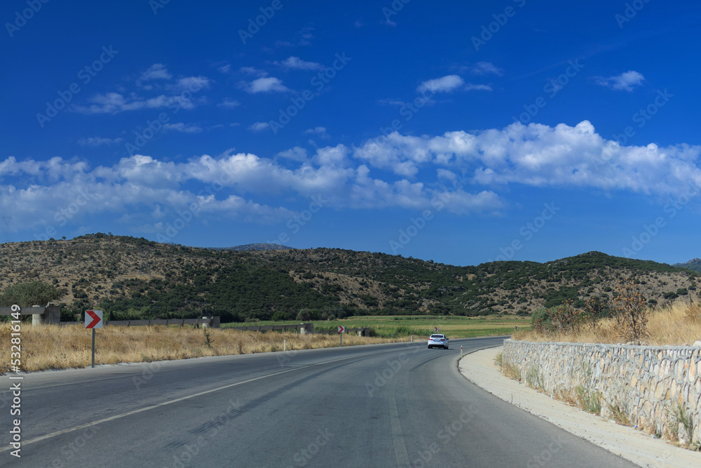 Highway wide road, transport and blue sky with clouds on a summer day