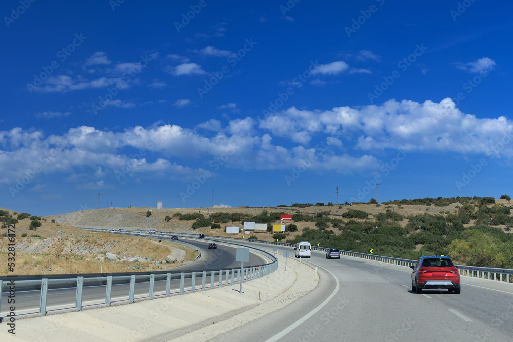 Highway wide road, transport and blue sky with clouds on a summer day Highway wide road, transport and blue sky with clouds on a summer day