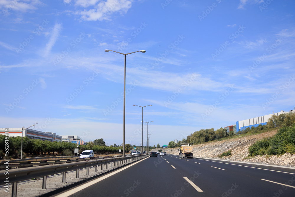 Highway wide road, transport and blue sky with clouds on a summer day Highway wide road, transport and blue sky with clouds on a summer day