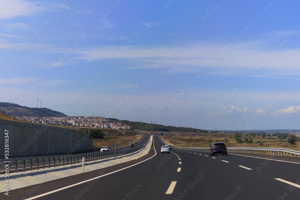 Highway wide road, transport and blue sky with clouds on a summer day Highway wide road, transport and blue sky with clouds on a summer day