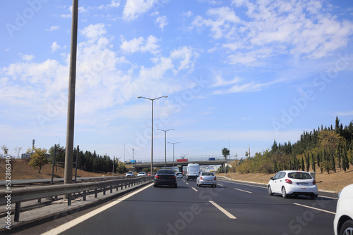 Highway wide road, transport and blue sky with clouds on a summer day © Kozlik_mozlik