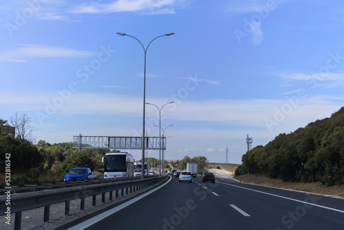Highway wide road, transport and blue sky with clouds on a summer day