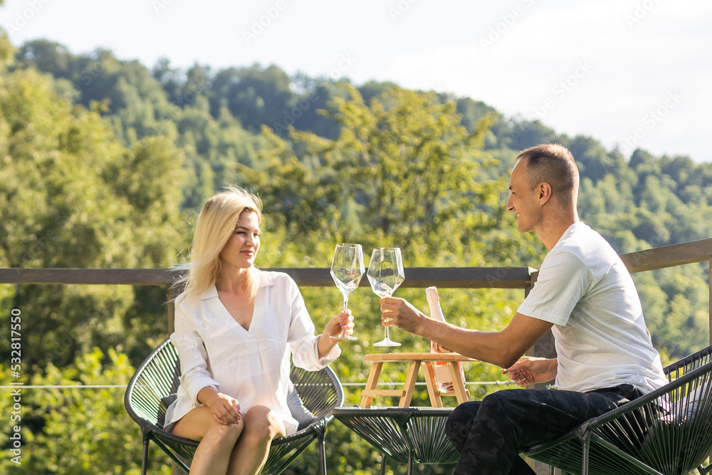 custom made wallpaper toronto digitalHappy couple sitting in a cozy home with a mountain view.