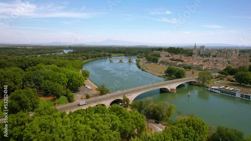 The drone aerial footage of Pont Saint Benezet bridge and Rhone river in Avignon. Avignon is a city on the Rhone river in southern France. The Pont Saint-Bénézet also known as the Pont d'Avignon. photo