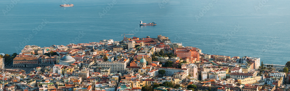 Naples, Italy. Top View Cityscape Skyline With Famous Landmarks And Part Of Gulf Of Naples In Sunny Day. Many Old Churches And Temples. Residential District. Panoramic View
