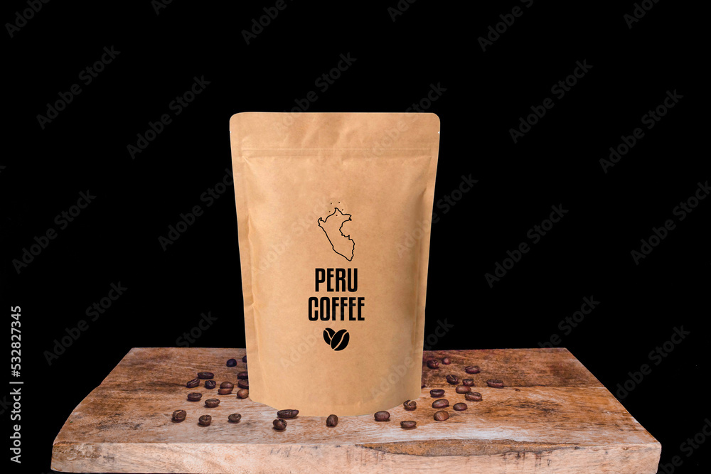 Peru coffee beans and eco friendly kraft paper package on wooden board