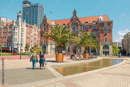 KATOWICE, POLAND - MAY 31, 2022: People relaxing on the square in the city centre of Katowice, Poland. Silesian Museum & Main Square