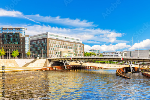 Bridge over the Spree and view on the modern buildings of Berlin, Germany