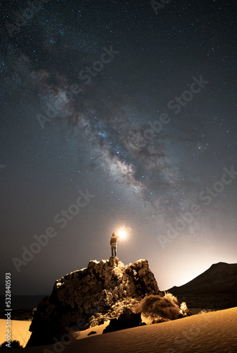 Milky Way on the Rock with Person and Flashlight