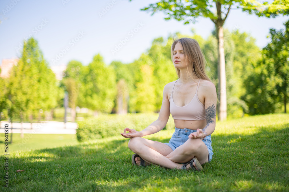 Girl practice yoga meditation outdoor in park Girl practice yoga meditation outdoor in park