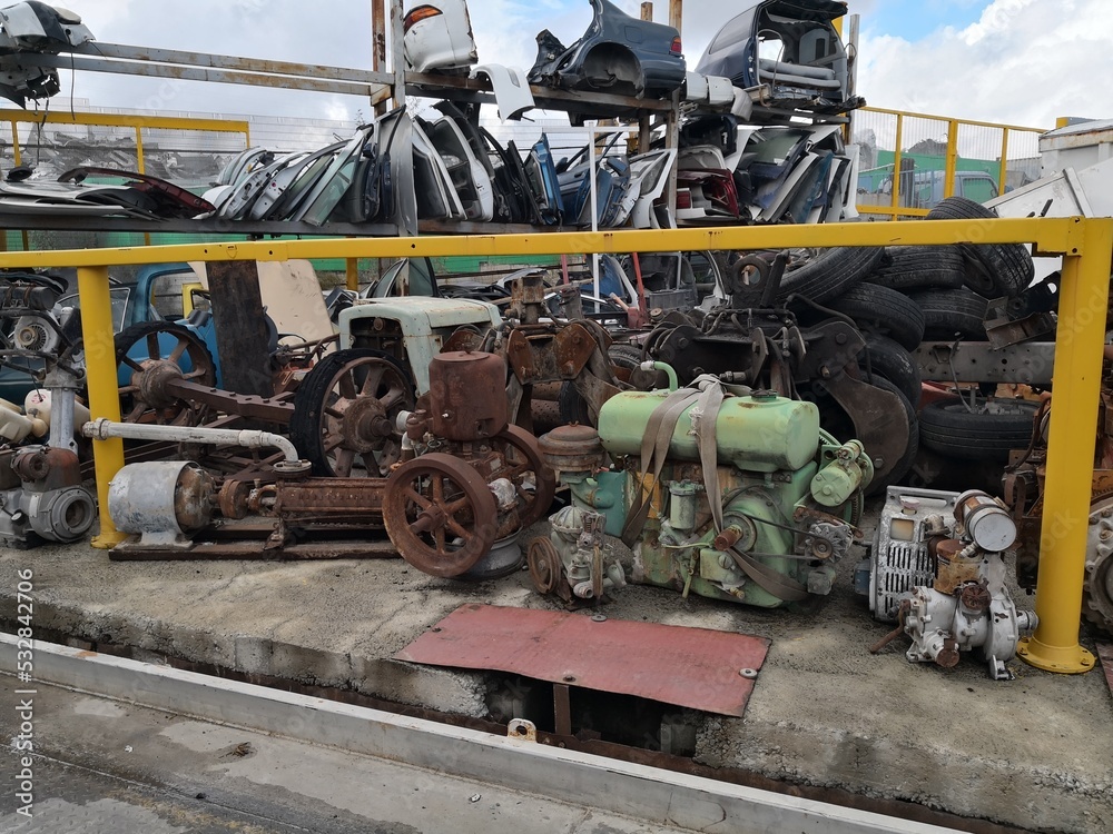 The scrap yard engine and cars parts.
