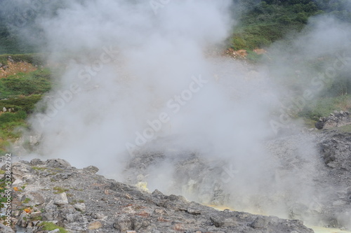 Sulphurous mountain valley with hot spring stream and steam at Tamagawa Onsen Hot spring in Senboku city, Akita prefecture, Tohoku region, northern Japan, Asia