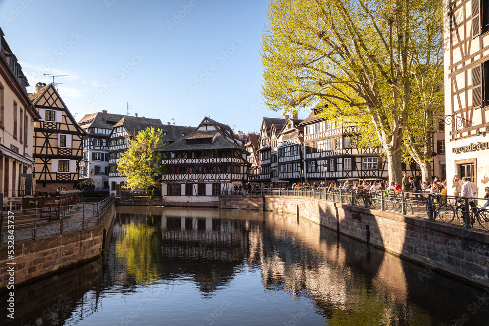 Traditional old alsatian houses from Pont st. Martin on a canal in Petit Venice (Small Venice) in Stasbourg in Alsace in the department of Haut-Rhin of the Grand Est region of France