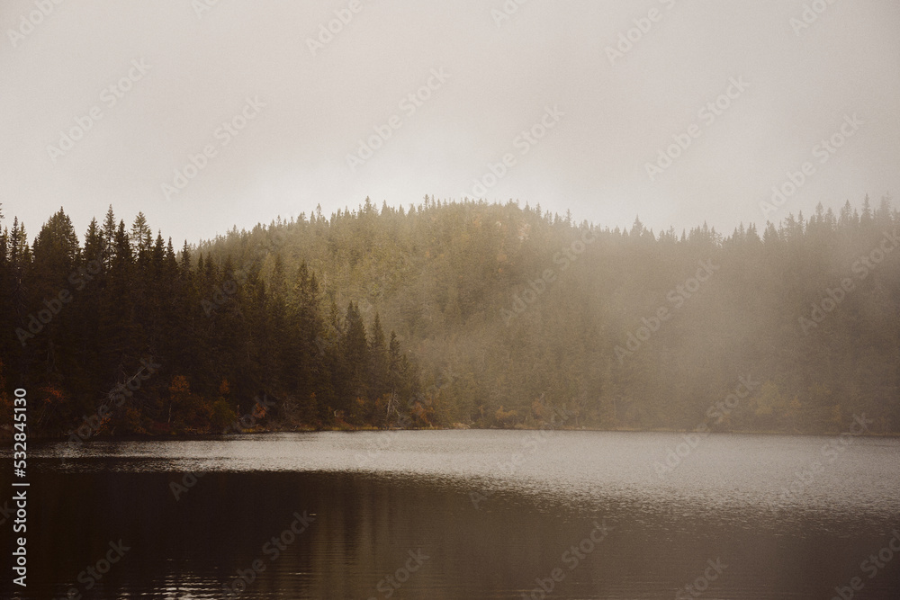 Middle Svartdalstjern Lake. Image from a trip to the Svartdalstjerna Forest Reserve of the Totenaasen Hills, Norway, in autumn. Middle Svartdalstjern Lake. Image from a trip to the Svartdalstjerna Forest Reserve of the Totenaasen Hills, Norway, in autumn.