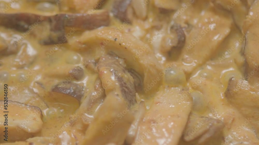 Vegetarian and vegan cuisine using Shitake mushroom and cream for preparation on the stove. on slowmotion Vegetarian and vegan cuisine using Shitake mushroom and cream for preparation on the stove. on slowmotion