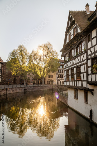 Traditional old alsatian houses at sunset from Pont st. Martin on a canal in Petit Venice (Small Venice) in Stasbourg in Alsace in the department of Haut-Rhin of the Grand Est region of France