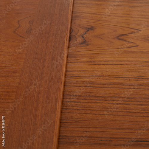 Wood grain detail of a vintage Danish Teak Draw Leaf Dining Table