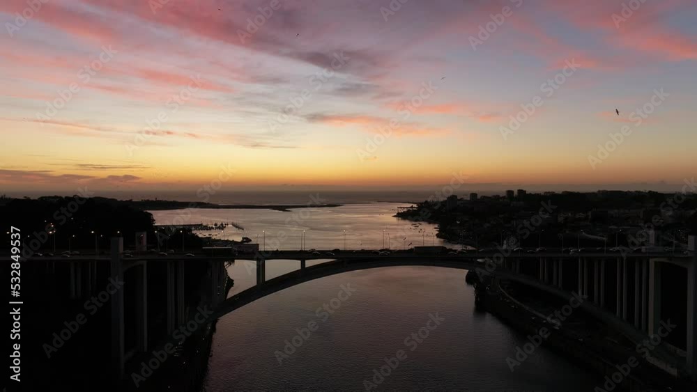 Aerial View of Traffic on Arrábida Bridge with River Douro in the Background. City of Porto at Sunset. Portugal 4k. Travel Concept Aerial View of Traffic on Arrábida Bridge with River Douro in the Background. City of Porto at Sunset. Portugal 4k. Travel Concept