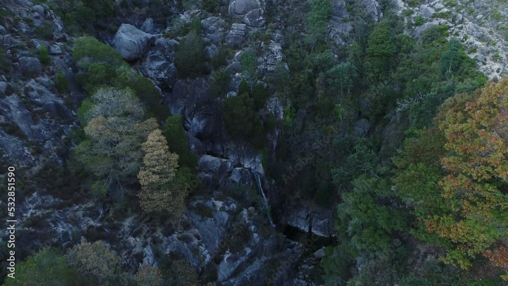 Hidden waterfall in the Mountain forest. Peaceful Place. Nature Landscape Aerial View. National Park of Gerês in Portugal. 4k. Travel Destination Hidden waterfall in the Mountain forest. Peaceful Place. Nature Landscape Aerial View. National Park of Gerês in Portugal. 4k. Travel Destination