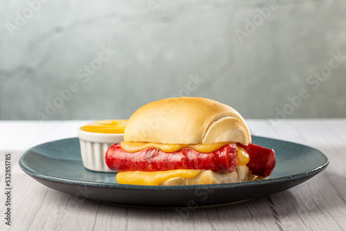 Sausage sandwich with melted cheese.