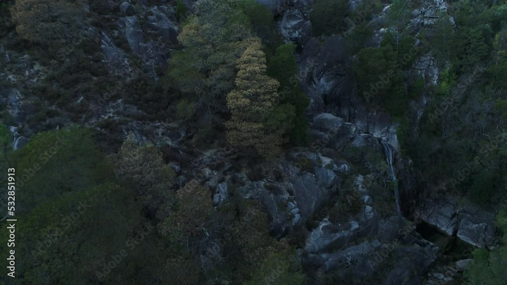 Hidden waterfall in the forest. Peaceful Place. Nature Landscape Aerial View. National Park of Gerês in Portugal. 4k. Travel Destination Hidden waterfall in the forest. Peaceful Place. Nature Landscape Aerial View. National Park of Gerês in Portugal. 4k. Travel Destination