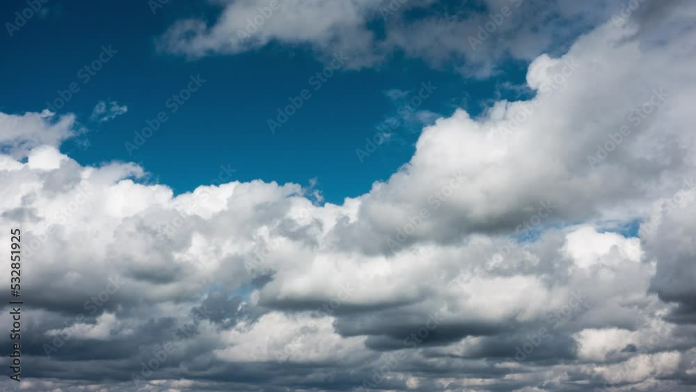 4K time lapse of fluffy cumulus clouds flying on blue sky. Cloudscape background. Intro for titles 4K time lapse of fluffy cumulus clouds flying on blue sky. Cloudscape background. Intro for titles