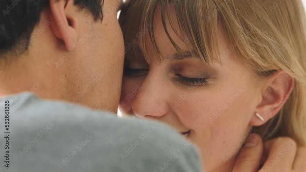 Love, face and couple kiss and embrace, happy and intimate in their home together. Closeup of passion by man and woman flirting, enjoying sensual moment and a sweet, romantic hug while bonding Love, face and couple kiss and embrace, happy and intimate in their home together. Closeup of passion by man and woman flirting, enjoying sensual moment and a sweet, romantic hug while bonding