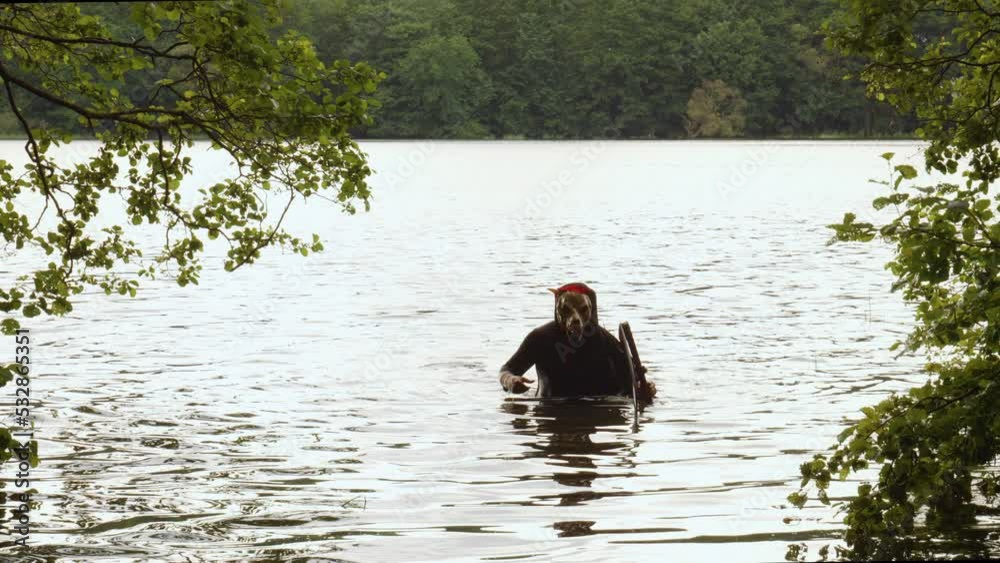Grim Reaper With Animal Skull Face Clutching A Scythe Walking Out Of The Water. - wide Grim Reaper With Animal Skull Face Clutching A Scythe Walking Out Of The Water. - wide