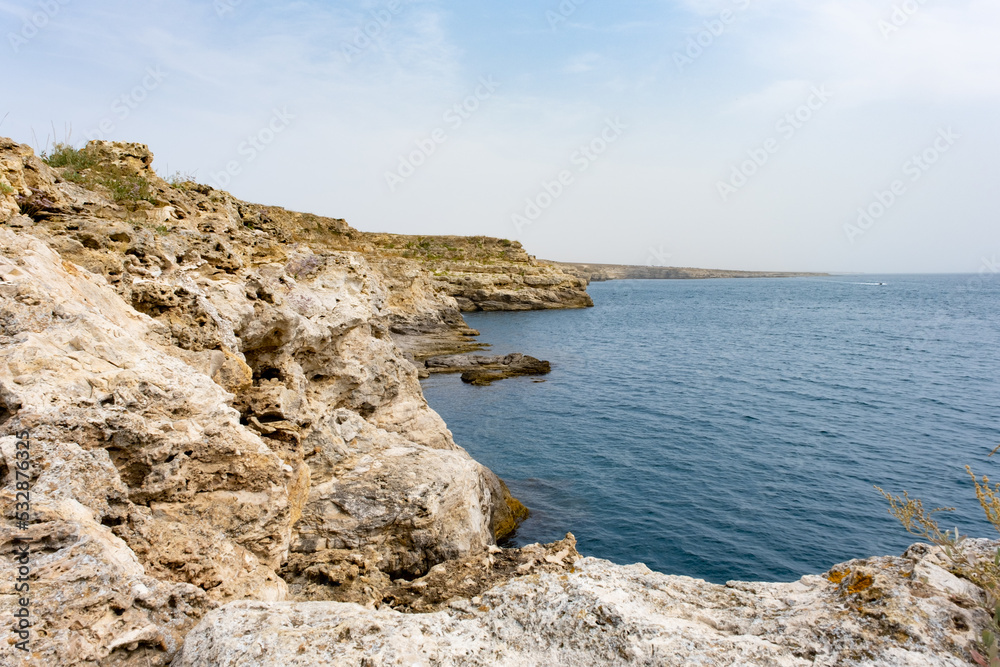 Cape Tarkhankut. Natural landmark of Crimea. Rocks and sea. Rocky coast of Crimea. Tourism, vacation in nature. Cape Tarkhankut. Natural landmark of Crimea. Rocks and sea. Rocky coast of Crimea. Tourism, vacation in nature.