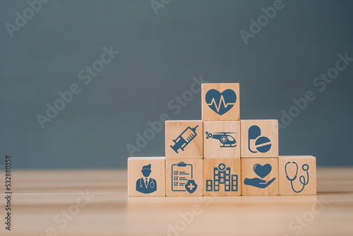 Wood block with healthcare medical icon. Health insurance - concept. Connection linkage for healthy wellness insurance and assurance.
