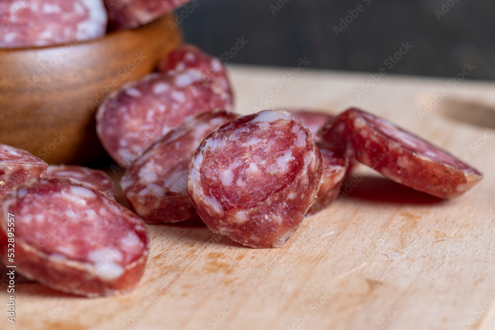 Cut the finished sausage into pieces on a cutting board