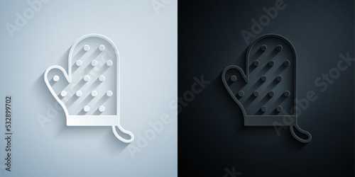 Paper cut Oven glove icon isolated on grey and black background. Kitchen potholder sign. Cooking glove. Paper art style. Vector