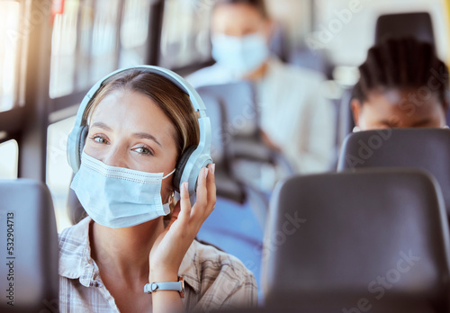 Covid, travel and music for woman on bus journey or transportation with mask for safety against covid 19 virus. Portrait of relax young girl with headphones streaming or listening to radio podcast