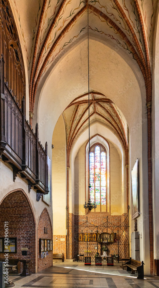 Aisle of historic Holy Mary gothic Kosciol Mariacki church in old town quarter of Trzebiatow in Poland