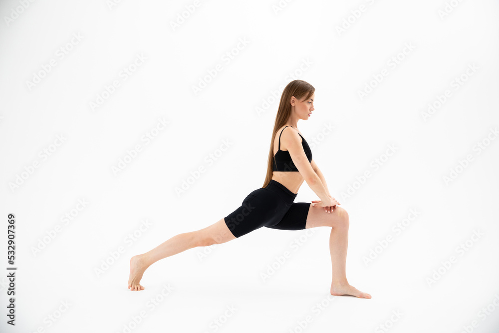 Beautiful girl in sportswear doing yoga