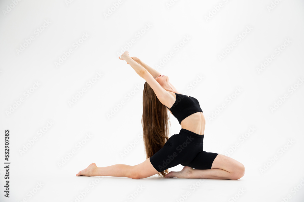Beautiful girl in sportswear doing yoga Beautiful girl in sportswear doing yoga