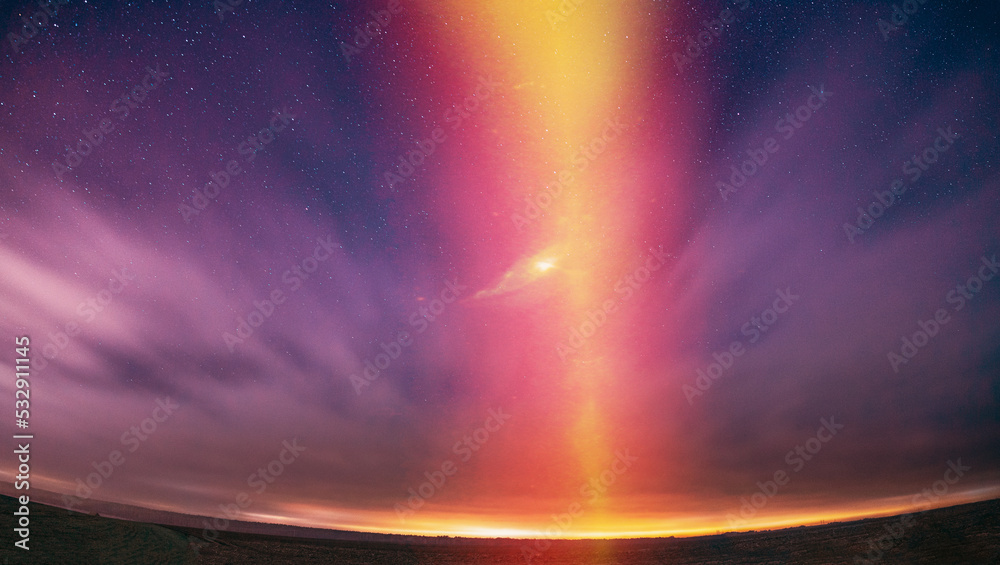 Amazing Beautiful Light Purpurea Illuminated Sky. Pink Light Effect Night Starry Sky Above Rural Countryside. Stars Flare Backlight Natural Background. Soft Colors. Concept Of Dream View. Imagination.