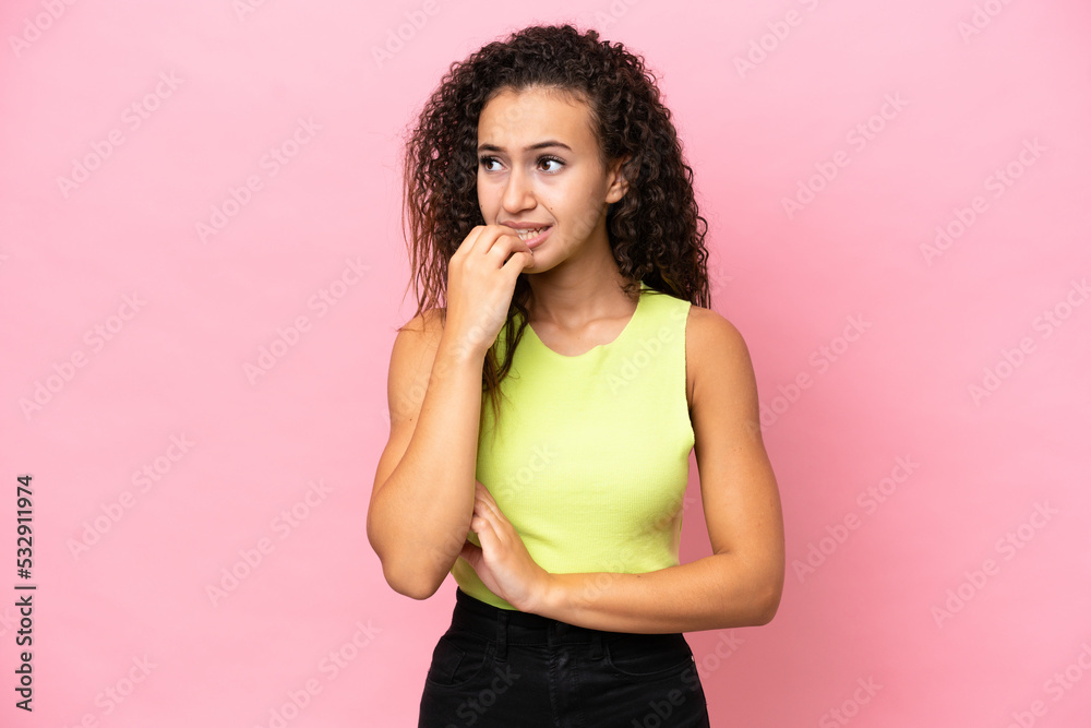 Young hispanic woman isolated on pink background is a little bit nervous Young hispanic woman isolated on pink background is a little bit nervous