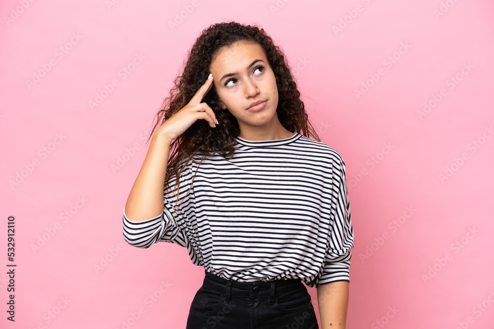 Young hispanic woman isolated on pink background with problems making suicide gesture Young hispanic woman isolated on pink background with problems making suicide gesture