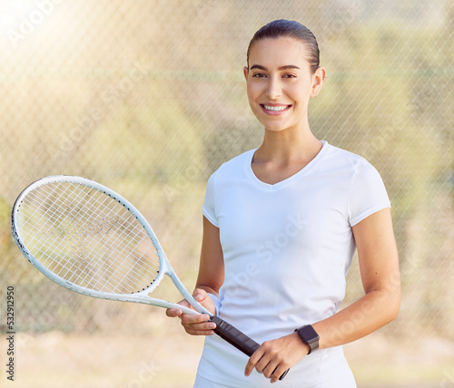 Woman, tennis and sports motivation on a court for fitness game, workout and competition training. Portrait, smile and happy player with racket for energy exercise, health wellness and winner mindset © Jade M/peopleimages.com