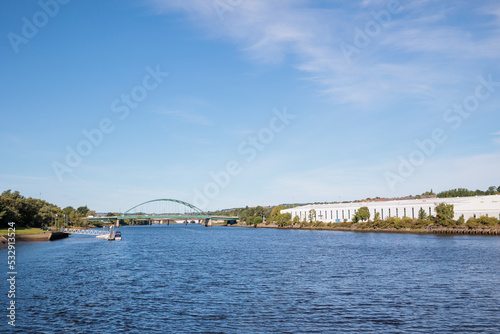 Blaydon England: 17th Sept 2022: View of Newcastle upon Tyne's Scotswood Bridge from the Tyne River in Blaydon. Sunny day with blue sky and light clouds