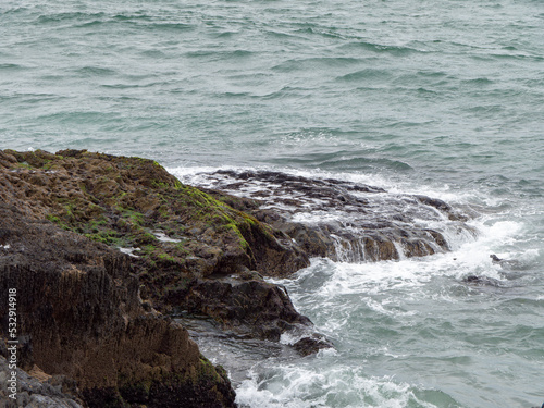 Wild rocks and sea water, landscape, rock formation beside body of water. Ocean waves & Cliffs
