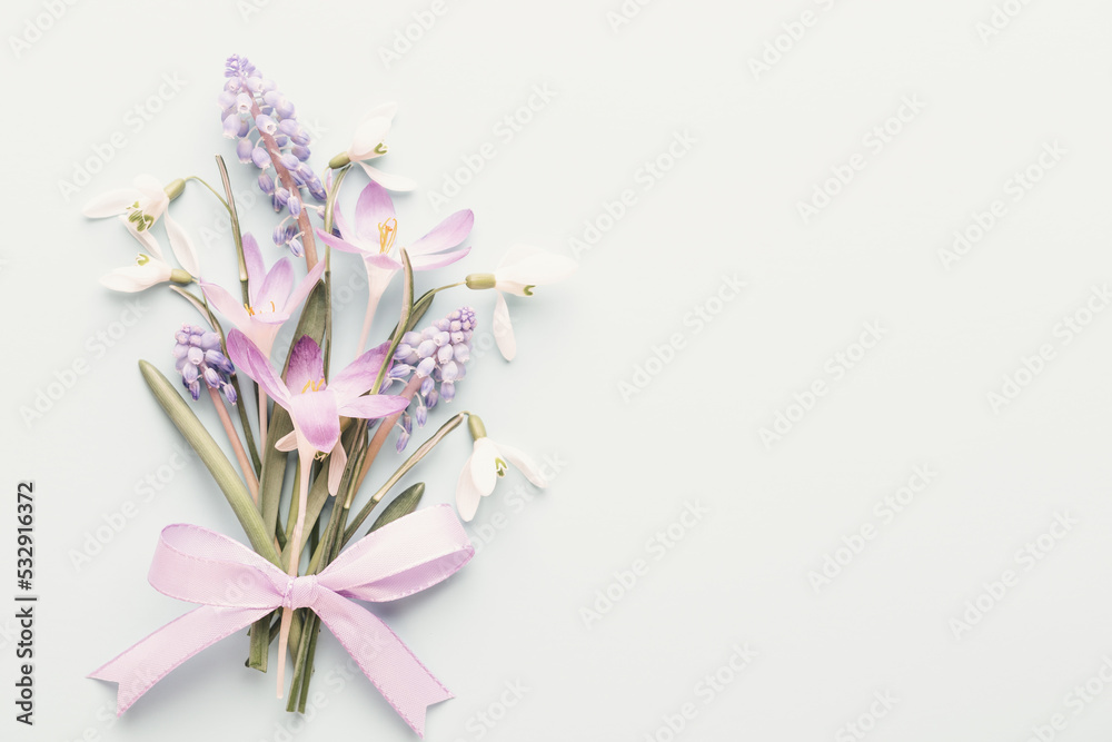 Fresh snowdrops on blue background with place for text. Spring greeting card. Mother day. Flat lay. Fresh snowdrops on blue background with place for text. Spring greeting card. Mother day. Flat lay.