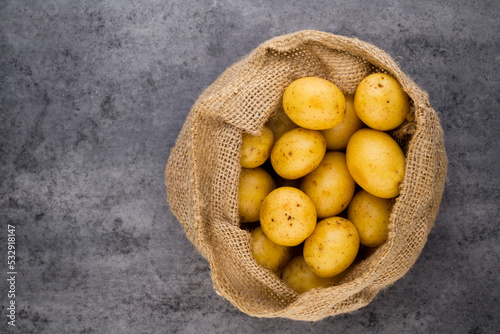 A bio russet potato wooden vintage background.