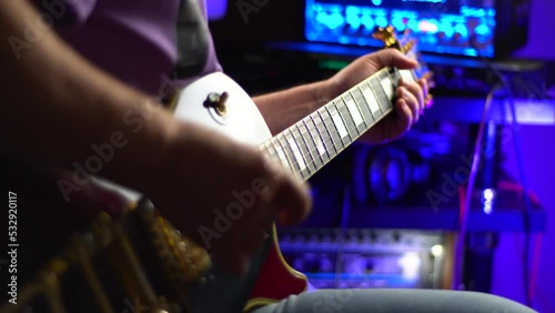 lead guitarist playing electrical guitar at studio	
