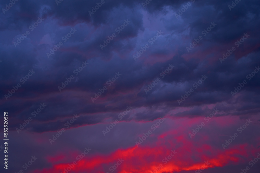 Fototapeta premium Fiery summer sunset landscape. Orange sun and dark blue sky