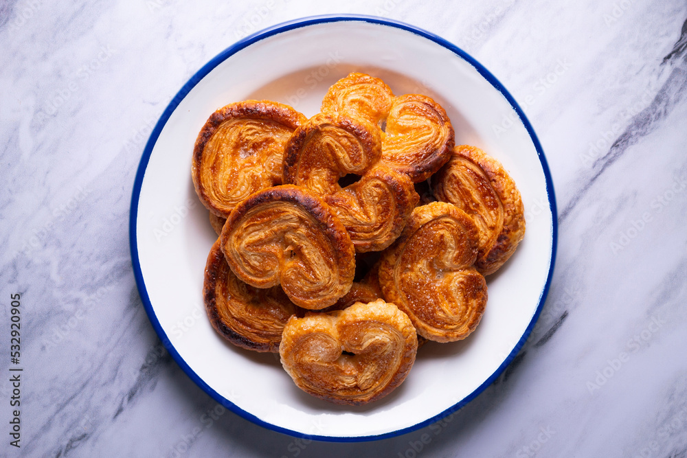 Palmeritas. Puff pastry palm trees with sugar. Spanish traditional dessert. Palmeritas. Puff pastry palm trees with sugar. Spanish traditional dessert.