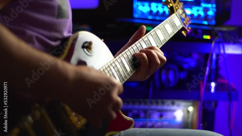 lead guitarist playing electrical guitar at studio	
